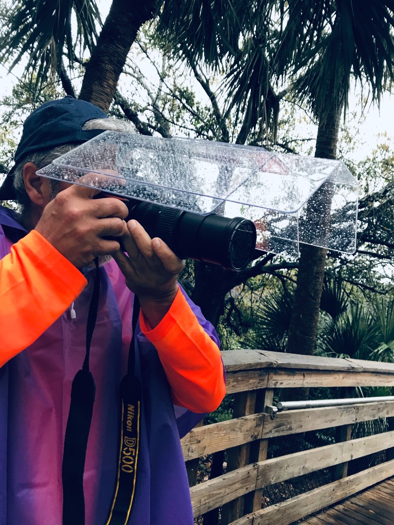 Camera Canopy&trade; in the rain protecting a DSLR